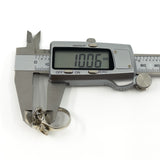 Vintage sterling silver elephant ring measured with digital calipers showing approx. 10.06mm depth