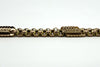 Side view of the antique 9ct rose gold Albert chain showing engraved bar links and faceted oval links