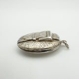 Side view showing floral engraving on sterling silver locket