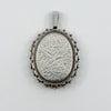 Vintage sterling silver oval locket with floral foliate engraving and raised decorative border
