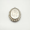 Detailed view of foliate engraving on large oval sterling silver locket