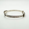 Foliate engraving on used sterling silver baby bangle