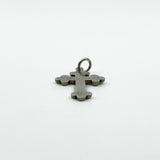Low side angle of engraved antique sterling silver cross pendant with rounded trefoil ends