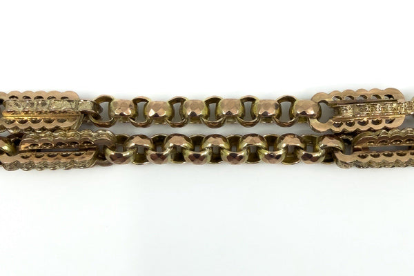 Close up of antique 9ct rose gold Albert chain with chunky bar and faceted oval links