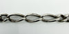 Close up of sterling silver Figaro links showing lion passant stamps on antique Albert chain