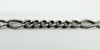 Close up of fancy Figaro links on antique sterling silver Albert chain with lion passant stamps