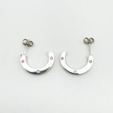 Flat lay showing both sterling silver earrings from above with gemstone placement visible