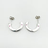 Flat lay showing both sterling silver earrings from above with gemstone placement visible