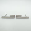 Side profile of sterling silver J half hoop earrings with gemstone settings visible at the base