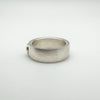 Side view of wide brushed sterling silver ring with solitaire CZ