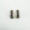 Close-up of black and white CZ earrings in sterling silver 925