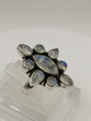 Sterling silver moonstone statement ring with a unique marquise and teardrop gemstone arrangement on a blackened setting.
