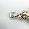 Close-up of full 925 hallmark and MH & U maker's mark on 1994 silver perfume pendant