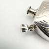 View of full hallmark set on silver bail, including 925, HJ, import and date stamps