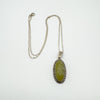 Vintage Connemara and marcasite pendant with 18 inch sterling silver chain laid flat