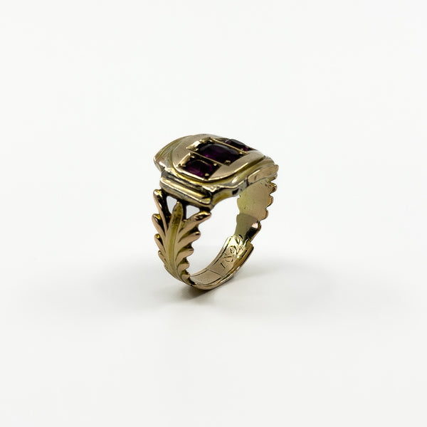 Angled profile of Georgian 9ct gold amethyst ring showing raised setting, shank detail and inner engraving