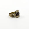 Side detail of antique Georgian 9ct gold amethyst trilogy ring with openwork shank and age-related wear