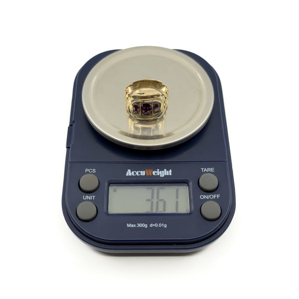 Antique Georgian 9ct gold amethyst trilogy ring on digital scales showing approx. 3.61g weight