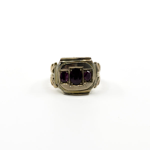 Front view of antique Georgian amethyst trilogy ring in tested 9ct gold with age-related wear