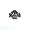 Antique sterling silver giardinetti brooch with marcasite and multicoloured paste stones in a floral basket design.