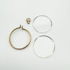 Antique gold locket taken apart showing frame, screw bail, and two glass panels
