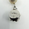 Close up of white gold filled rose clasp stamped 14/20L on freshwater pearl bracelet