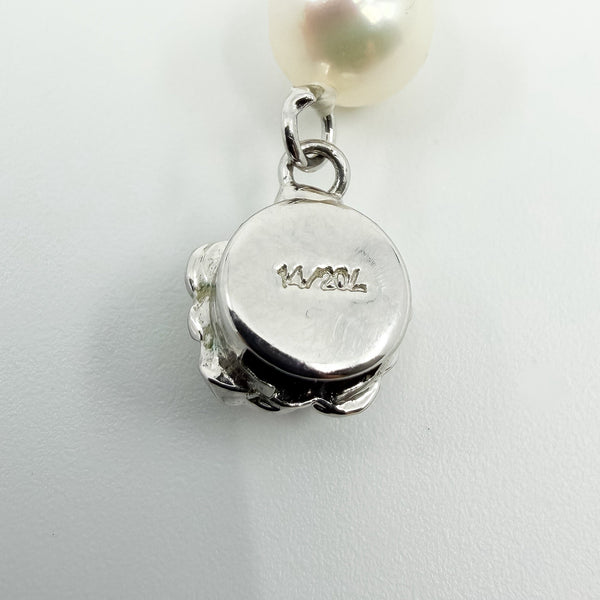 Close up of white gold filled lobster clasp stamped 14/20L on freshwater pearl necklace