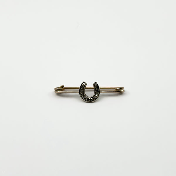 Front view of antique 9ct gold and silver horseshoe brooch with rose cut diamond detail
