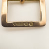 Close-up showing 375, leopard head, S and duty mark on antique gold charm