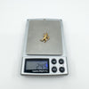 Vintage Sagittarius archer charm on digital scales showing weight of 2.45g