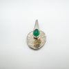 Sterling silver pendant with chrysoprase cabochon seen from top angle