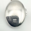Close up of HD and 925 stamp on silver locket back