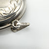 Close-up of Birmingham 1996 hallmarks on locket bail including 925 and maker's mark