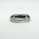 Close-up of ZR and A+VT hallmarks on outer band of vintage sapphire ring