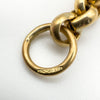 Close-up of 9ct gold jump ring with hallmarks on vintage T-bar charm