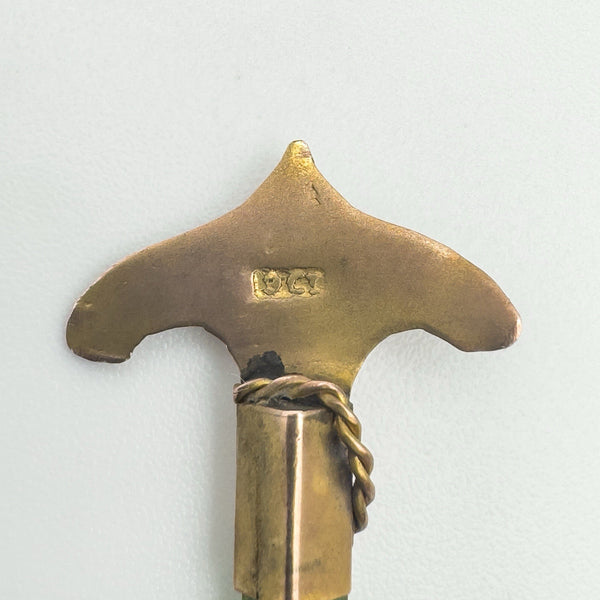Close-up showing hallmark at the base of the gold anchor design