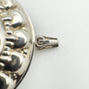 Close-up of 925 and GG hallmarks on sterling silver locket bail