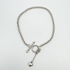 Sterling silver toggle bracelet with dangling heart charm on rolo chain