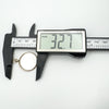 Digital caliper measuring total height of antique gold glass locket as 32.7mm