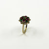 Side view of vintage 18ct gold gemstone cluster ring showing the high-set cocktail ring design