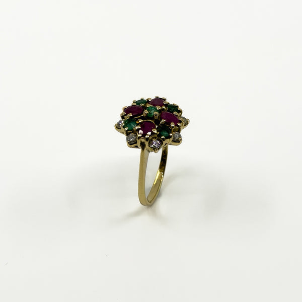 Side view of vintage 18ct gold gemstone cluster ring showing the high-set cocktail ring design