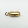 Close-up of side hinge and clasp on solid 18ct gold kidney bean locket pendant