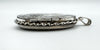 Close-up of silver locket hinge and twisted edge detailing