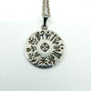 Front of Irish sterling silver History of Ireland pendant on chain, showing 12 symbols and central cross.