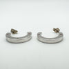 Earrings displayed horizontally to highlight depth and flat outer edge with gemstone accents