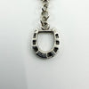 Close up of vintage sterling silver horsebit bracelet showing the 925 stamp on the horseshoe link.