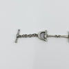 Close up of the sterling silver horseshoe end link on the vintage horsebit snaffle bracelet.