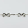 Vintage sterling silver horsebit snaffle bracelet showing two equestrian links and centre connector.