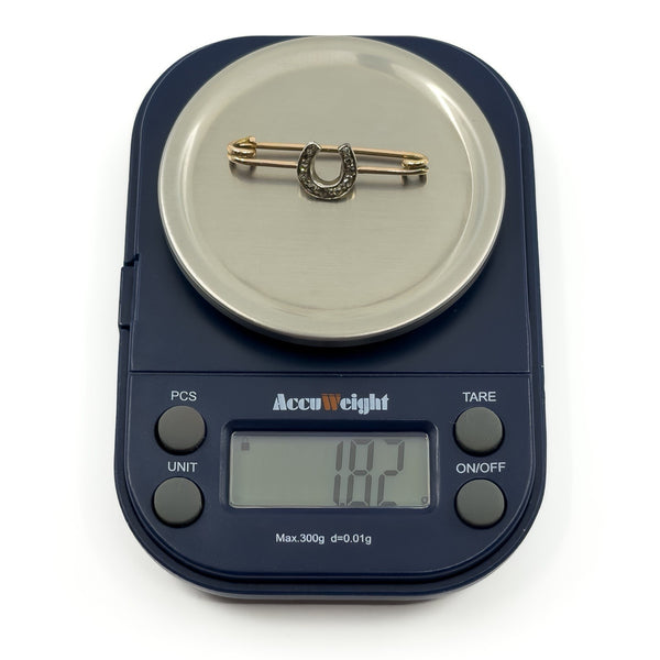 Antique 9ct gold and silver diamond horseshoe bar brooch weighing approx 1.82g on digital scales