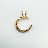 Back view of antique ruby and diamond horseshoe charm in 9ct gold